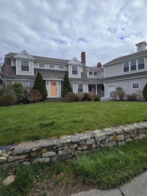 Two-story residential home exterior painted by WJ Services